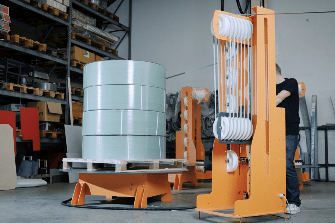 Jumbo dispenser for automatic strapping machine