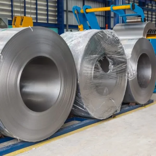 Three steel coils in an industrial setting High-strength strapping