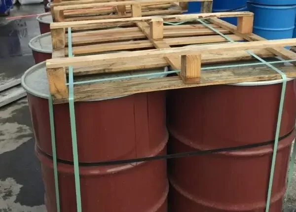Strapping of brown chemical drum with pallet and strapping tape – chemical cargo lashing